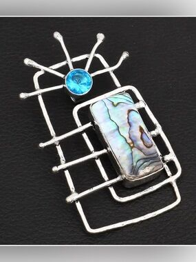 2 1/2 inch, 925 marked, Abalone Shell and Blue Topaz  pendant .